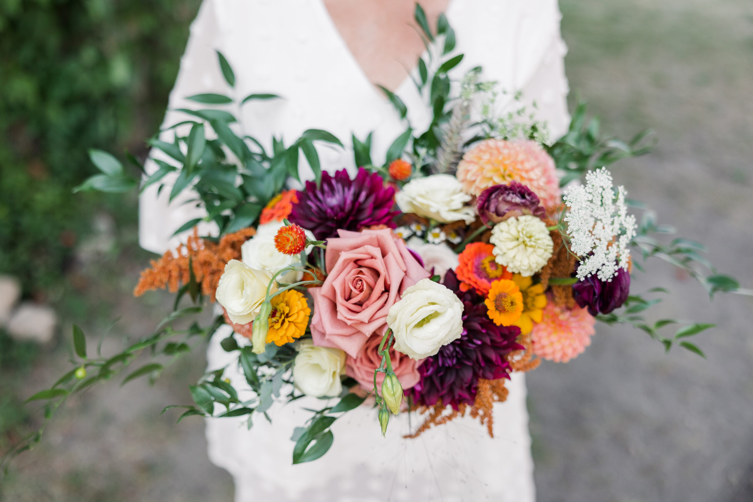 Vibrant Floral and terracotta fall wedding at Elm Creek Park Reserve Chalet in Maple Grove Minnesota