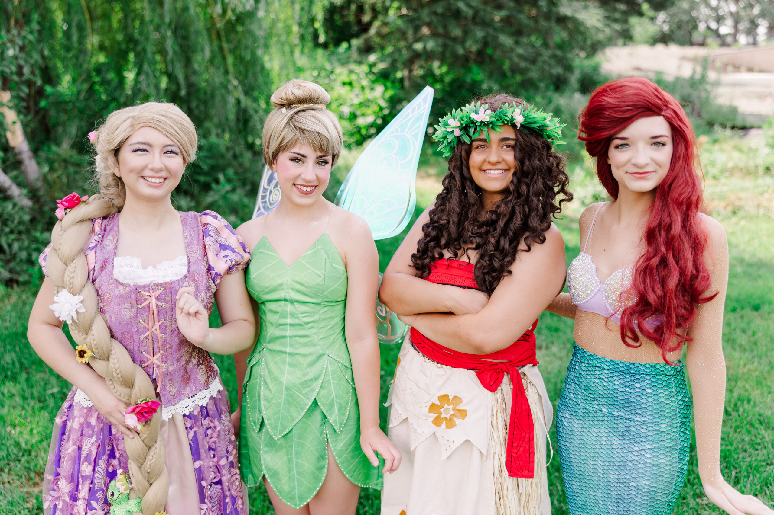 Children engaging with princesses Ariel, Moana, Tinkerbell, and Rapunzel at the Princesses In The Park event in Aquatore Park, Blaine, Minnesota