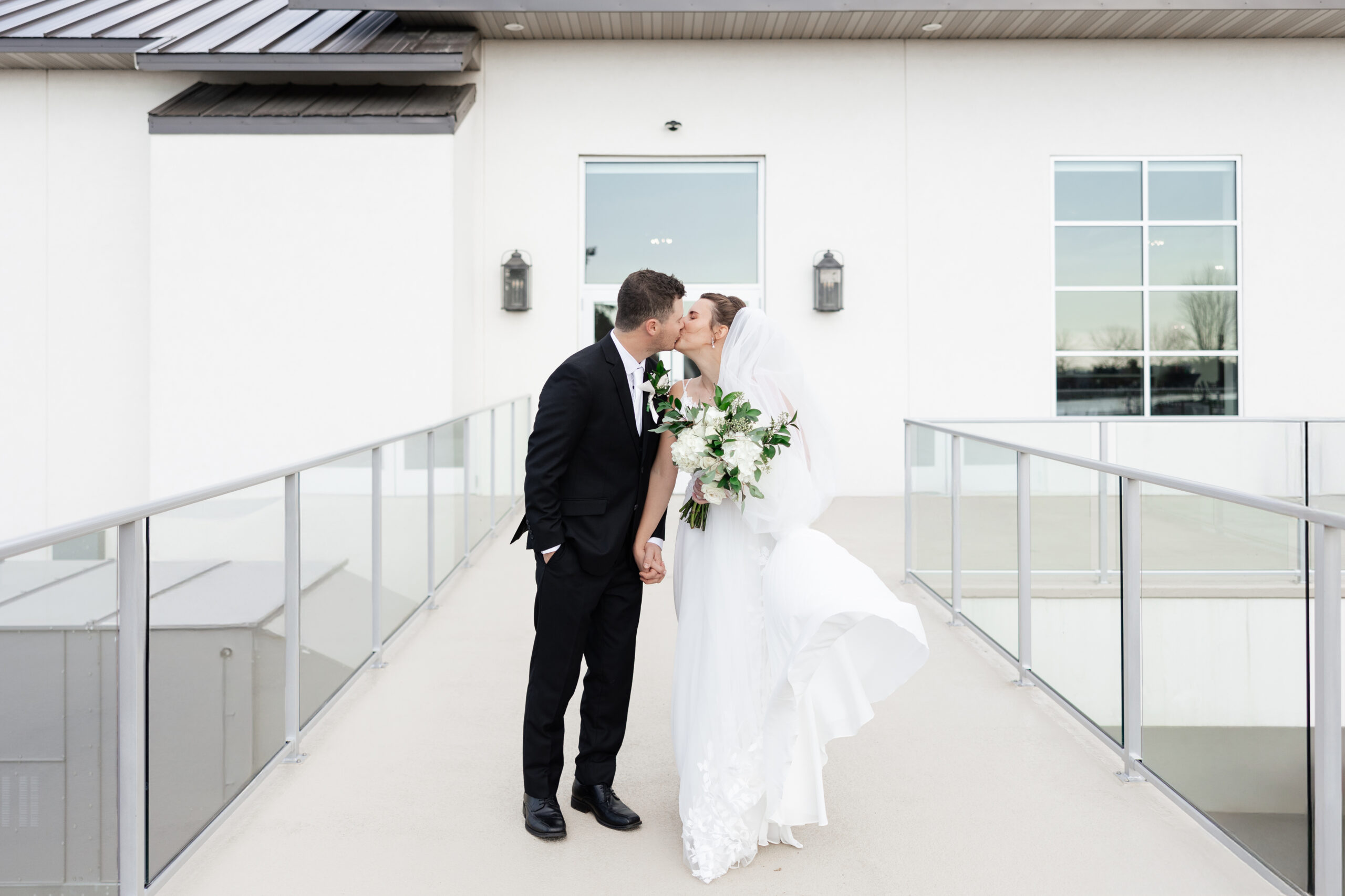 Elegant November wedding at Wexford at Emerald Greens with black, white, and eucalyptus decor and stunning indoor portraits.