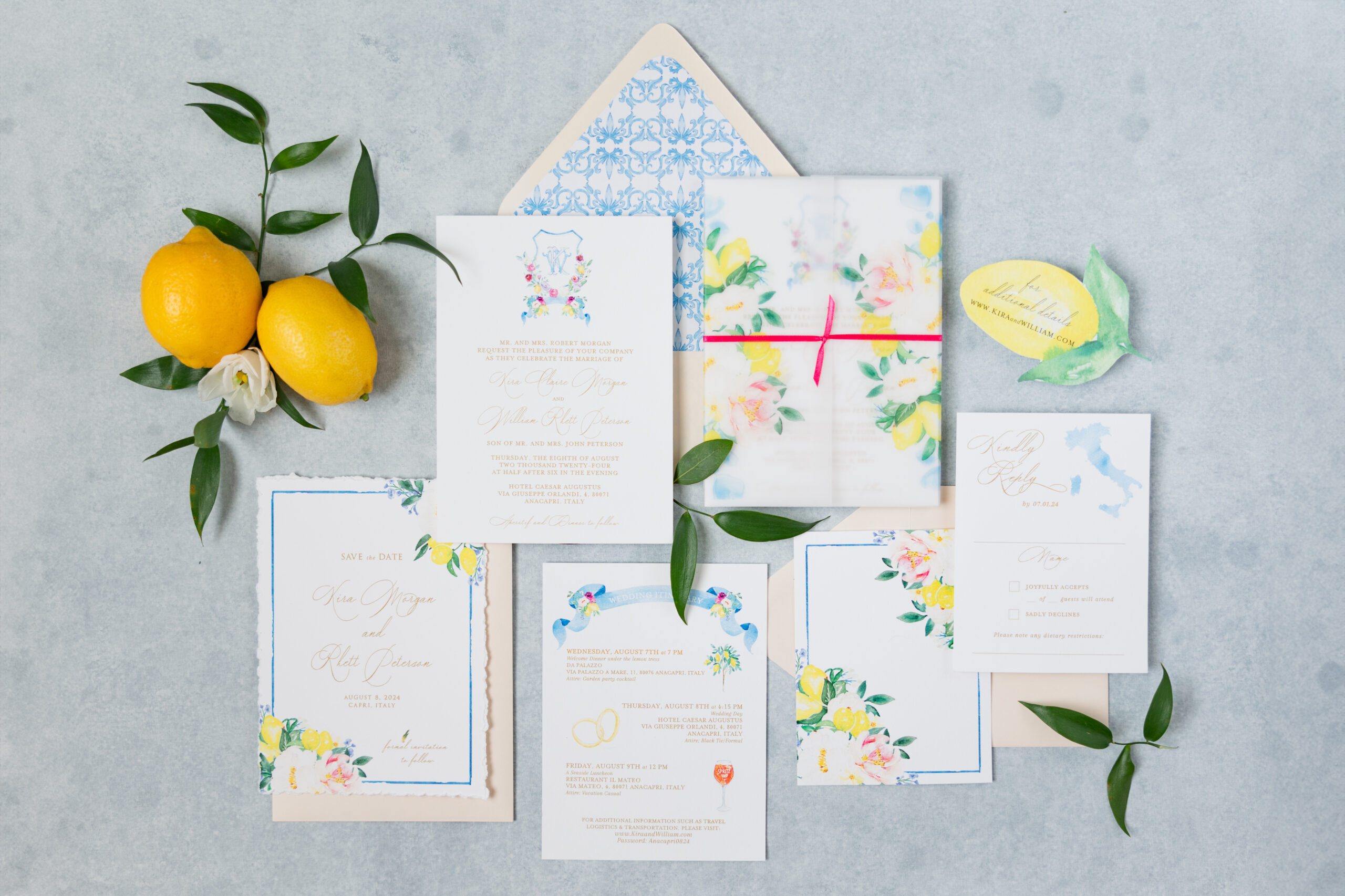 Flatlay of an elegant wedding invitation suite designed by Ivory Isle Art + Design, featuring soft florals, RSVP card, and custom details.